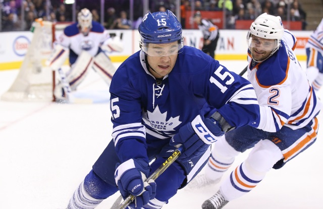 Maple Leafs P.A. Parenteau and Edmonton Oilers Andrej Sekera