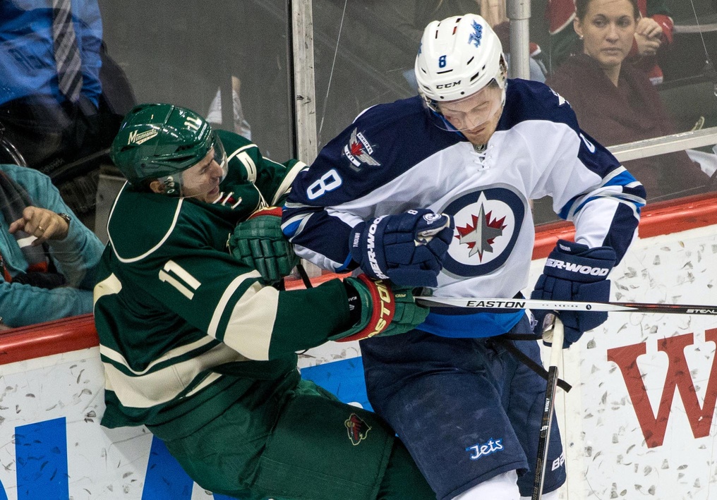 Jacob Trouba of the Winnipeg Jets and Zach Parise of the Minnesota Wild