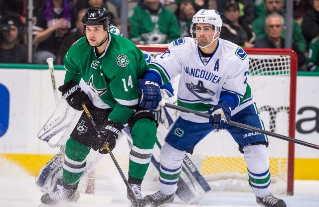 Dan Hamhuis of the Vancouver Canucks and Jamie Benn of the Dallas Stars