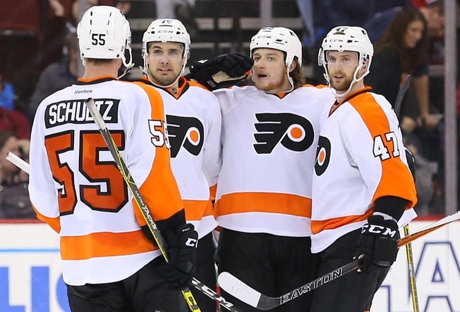 Ryan White, Nick Schultz of the Philadelphia Flyers