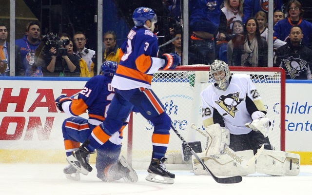 Kyle Okposo and Travis Hamonic of the New York Islanders