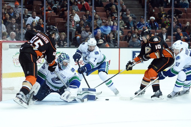 Dan Hamhuis and Ryan Miller of the Vancouver Canucks