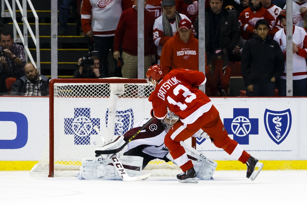 Pavel Datsyuk of the Detroit Red Wings and Semyon Varlamov of the Colorado Avalanche