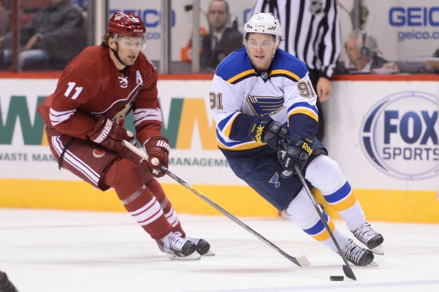 Martin Hazal of the Arizona Coyotes and Vladimir Taradenko of the St. Louis Blues