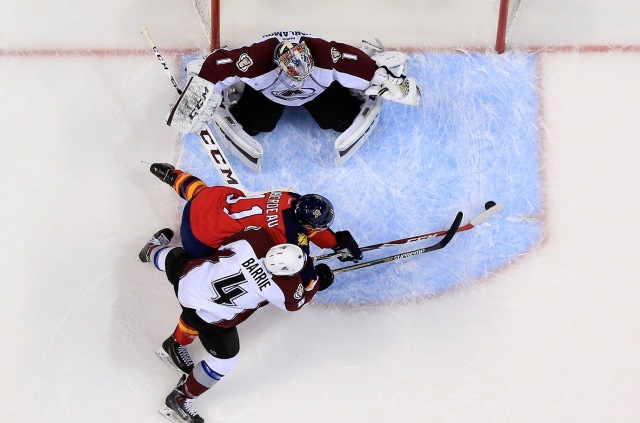 Tyson Barrie of the Colorado Avalanche and Jonathan Huberdeau of the Florida Panthers