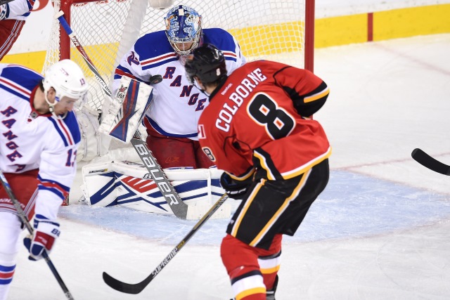 Joe Colborne of the Calgary Flames and Antti Raanta of the New York Rangers