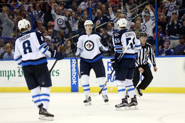 Jacob Trouba and Mark Scheifele of the Winnipeg Jets