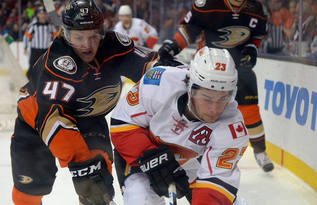 Sean Monahan of the Calgary Flames and Hampus Lindholm of the Anaheim Ducks