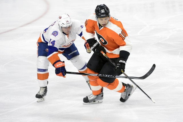 Brayden Schenn of the Philadelphia Flyers and Thomas Hickey of the New York Islanders