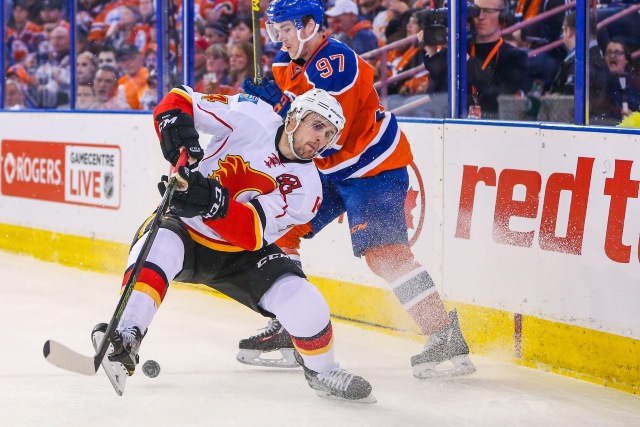 Kris Russell, then of the Calgary Flames and Connor McDavid of the Edmonton Oilers