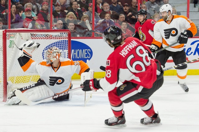 Mike Hoffman of the Ottawa Senators and Steve Mason of the Philadelphia Flyers