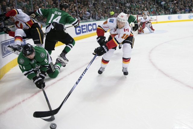 Tyler Seguin of the Dallas Stars and Matt Stajan of the Calgary Flames