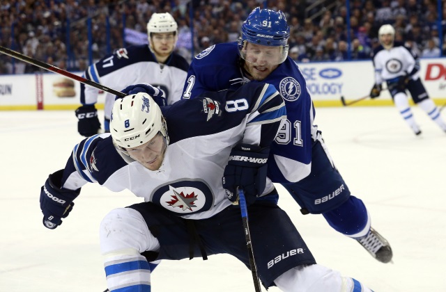 Jacob Trouba of the Winnipeg Jets and Steven Stamkos of the Tampa Bay Lightning