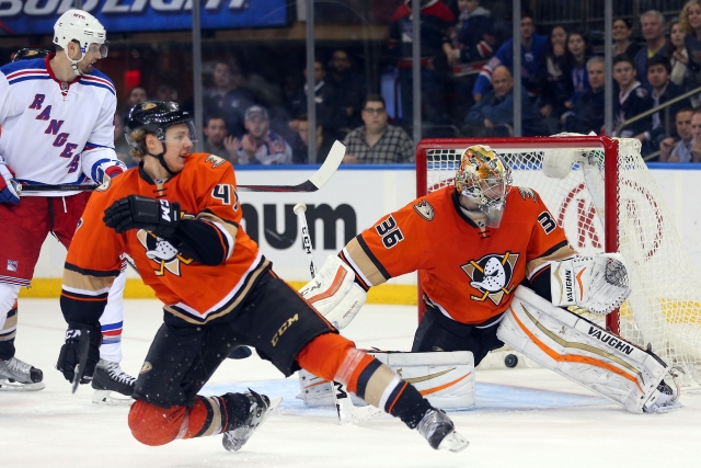 Hampus Lindholm of the Anaheim Ducks and Rick Nash of the New York Rangers