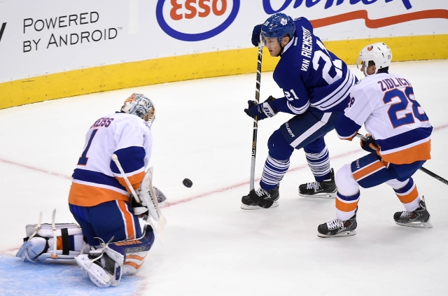 James van Riemsdyk of the Toronto Maple Leafs and Thomas Greiss of the NY Islanders