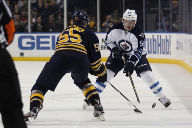 Rasmus Ristolainen of the Buffalo Sabres and Marko Dano of the Winnipeg jets