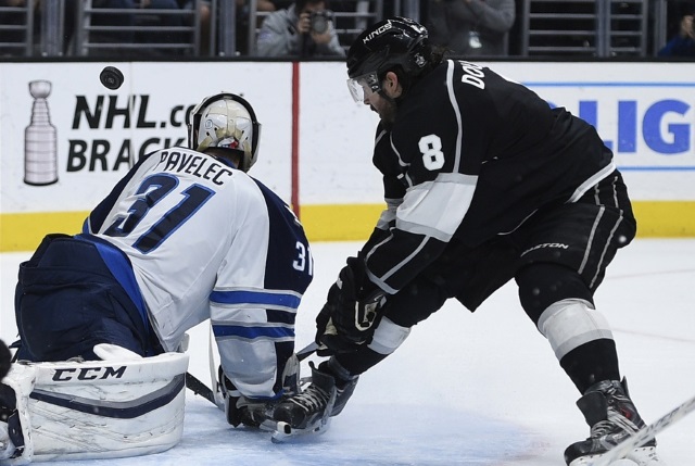 Ondrej Pavelec of the Winnipeg Jets and Drew Doughty of the LA Kings