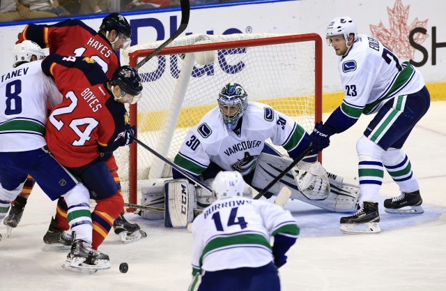 Alex Edler and Chris Tanev of the Vancouver Canucks