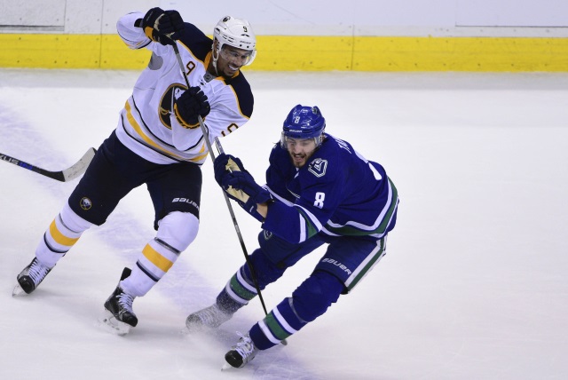 Evander Kane of the Buffalo Sabres and Chris Tanev of the Vancouver Canucks