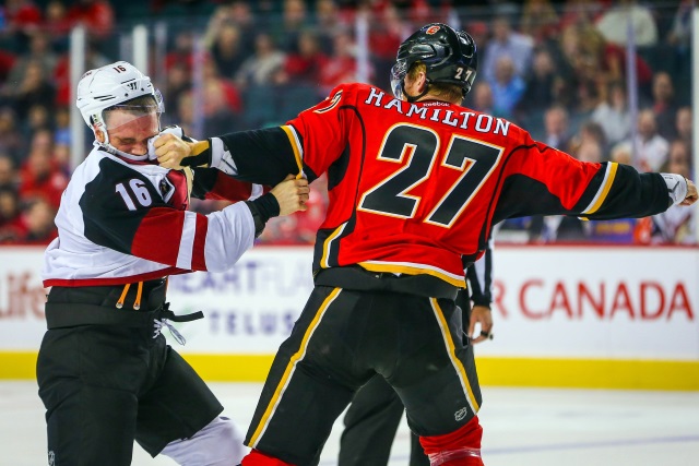 Dougie Hamilton of the Calgary Flames and Max Domi of the Arizona Coyotes