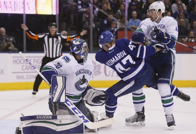 Erik Gudbranson and Ryan Miller of the Vancouver Canucks