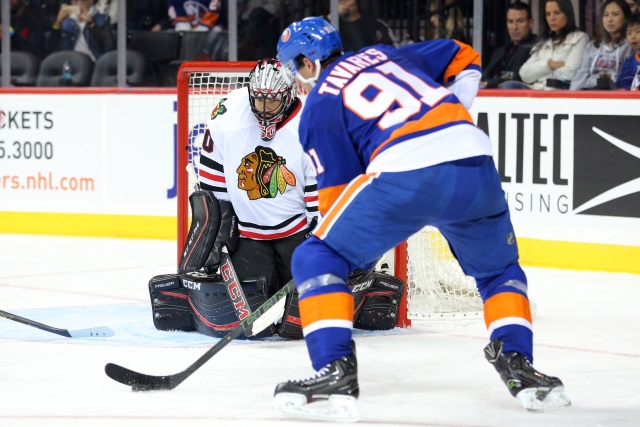 John Tavares of the New York Islanders and Corey Crawford of the Chicago Blackhawks