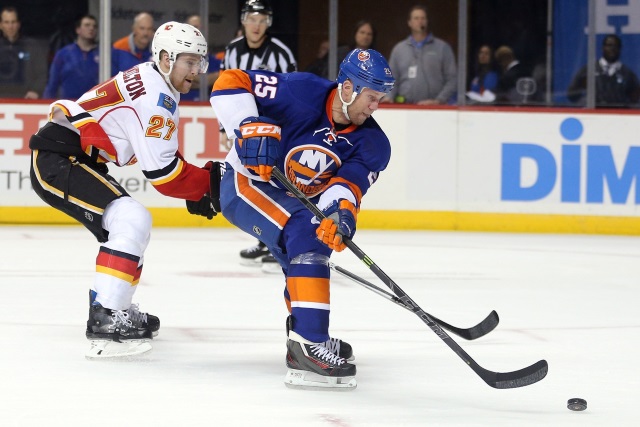 Dougie Hamilton of the Calgary Flames and Jason Chimera of the New York Islanders