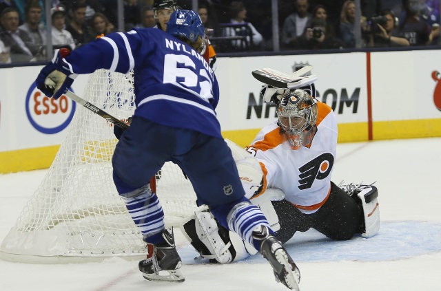 Willam Nylander of the Toronto Maple Leafs and Steve Mason of the Philadelphia Flyers