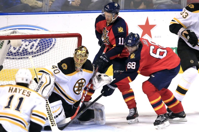 Tuukka Rask of the Boston Bruins and Aleksander Barkov of the Florida Panthers