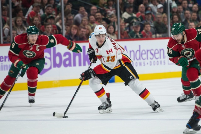 Johnny Gaudreau of the Calgary Flames and Mikko Koivu of the Minnesota Wild