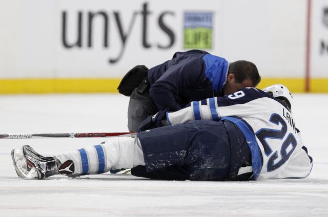 Buffalo Sabres Jake McCabe lays out Winnipeg Jets Patrik Laine