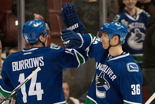 Jannik Hansen and Alex Burrows of the Vancouver Canucks