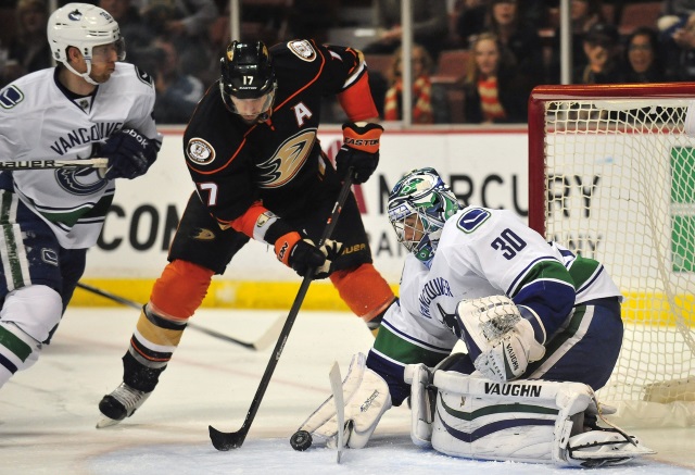 Ryan Miller and Jannik Hansen of the Vancouver Canucks