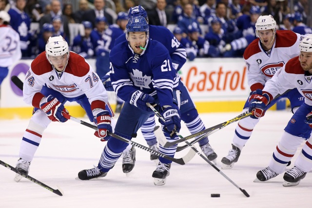 James van Riemsdyk of the Toronto Maple Leafsand Alexei Emelin of the Montreal Canadiens