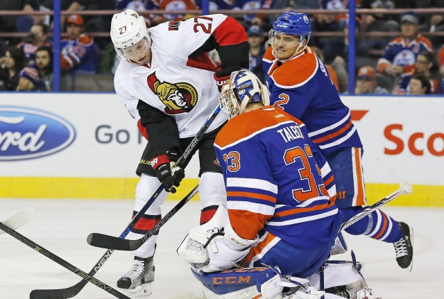 Curtis Lazar of the Ottawa Senators and Cam Talbot of the Edmonton Oilers