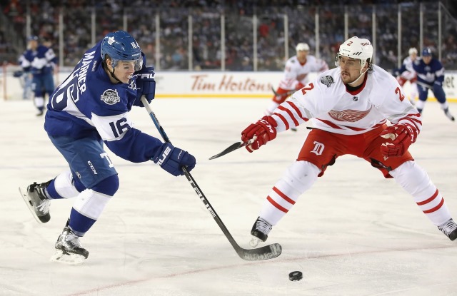 Mitch Marner of the Toronto Maple Leafs and Brendan Smith of the Detroit Red Wings