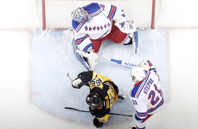 Henrik Lundqvist of the New York Rangers and Carl Hagelin of the Pittsburgh Penguins