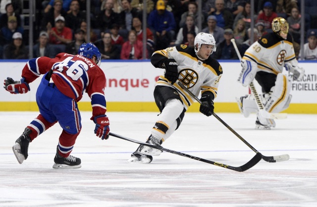 Ryan Spooner of the Boston Bruins and Artturi Lehkonen of the Montreal Canadiens