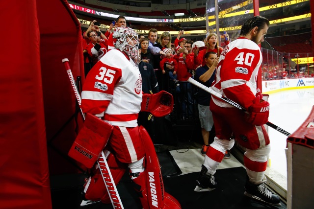 Jimmy Howard and Henrik Zetterberg of the Detroit Red Wings