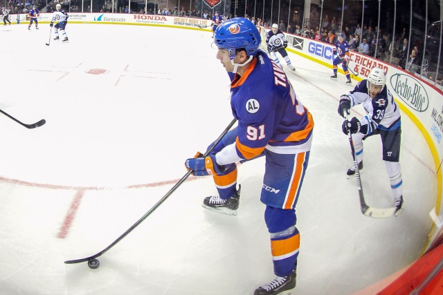 John Tavares of the New York Islanders and Toby Enstrom of the Winnipeg Jets