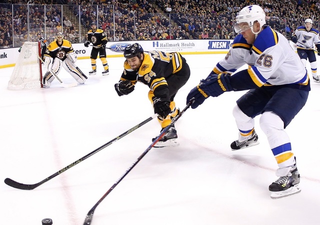 Adam McQuaid of the Boston Bruins and Paul Stastny of the St. Louis Blues