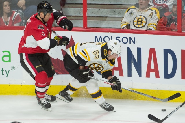 Marc Methot of the Ottawa Senators and Brad Marchand of the Boston Bruins