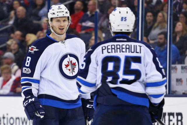 Jacob Trouba and Mathieu Perreault of the Winnipeg Jets