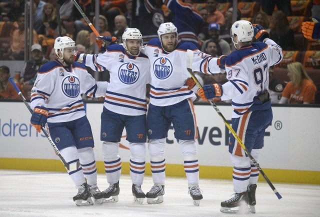 Edmonton Oilers Leon Draisaitl, Connor McDavid and Kris Russell