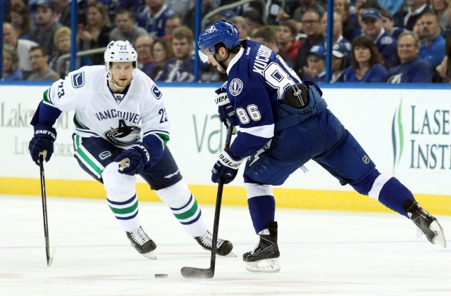 Alex Edler of the Vancouver Canucks and Nikita Kucherov of the Tampa Bay Lightning