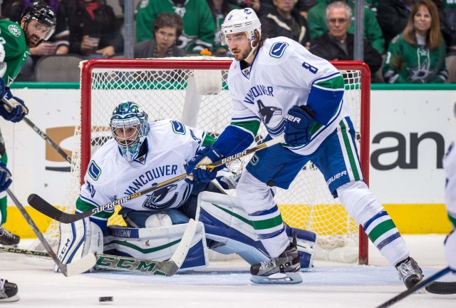 Ryan Miller and Chris Tanev of the Vancouver Canucks