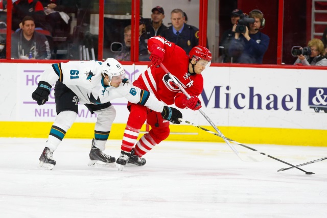 Justin Braun of the San Jose Sharks and Jeff Skinner of the Carolina Hurricanes