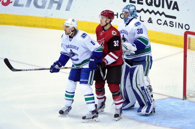 Ryan Miller and Chris Tanev of the Vancouver Canucks