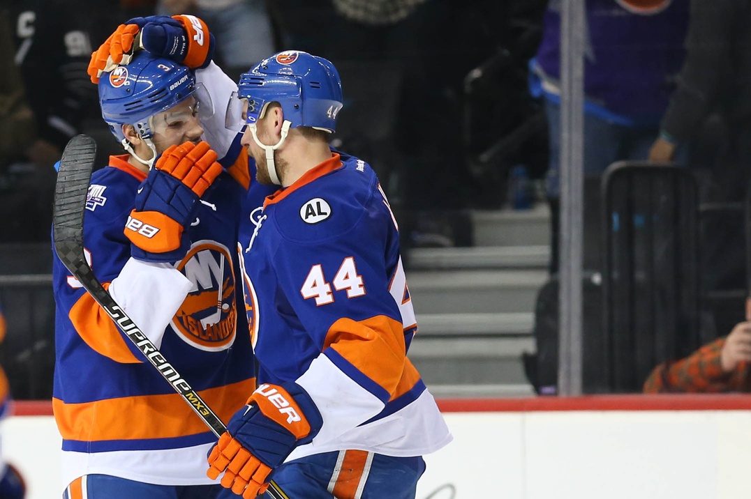 Travis Hamonic and Calvin de Haan of the New York Islanders