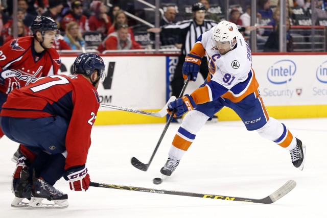 John Tavares of the New York Islanders and Karl Alzner of the Washington Capitals